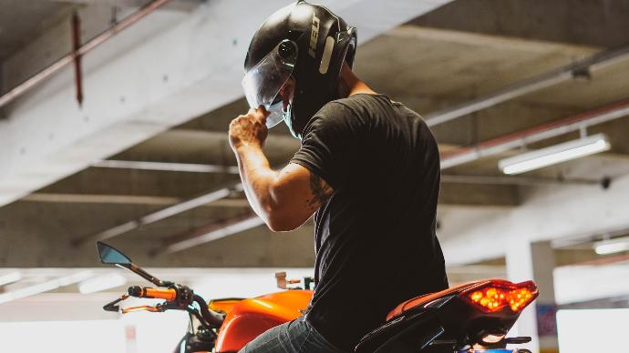 man in black t-shirt wearing helmet